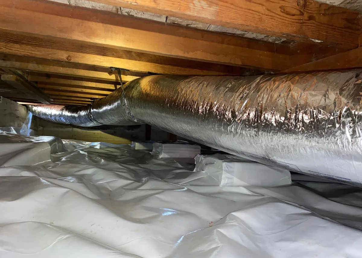 New insulated flexible air duct installed in a California home crawl space